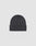 The LIVE FAST DIE YOUNG Basic Beanie is a dark gray cotton hat with a folded brim and a small rectangular tag on the left side, shown on a light gray background. Care instructions are provided for easy maintenance.