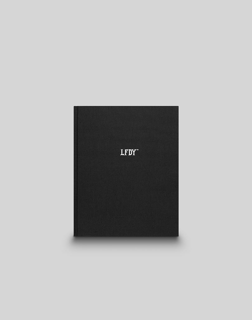 The LFDY Brand Bible by LIVE FAST DIE YOUNG is a black, square hardcover book with LFDY in white on the cover, shown against a light gray background.