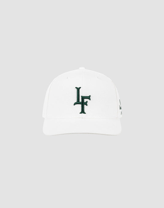 A white LF Snapback by LIVE FAST DIE YOUNG on a light gray background, featuring a dark green LF Logo-Stick embroidered on the front.