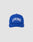 The Live Fast Unstructured Cap by LIVE FAST DIE YOUNG is a blue baseball cap with LIVE FAST in bold white letters on the front and a Flag-Label on the side, displayed against a plain light gray background.