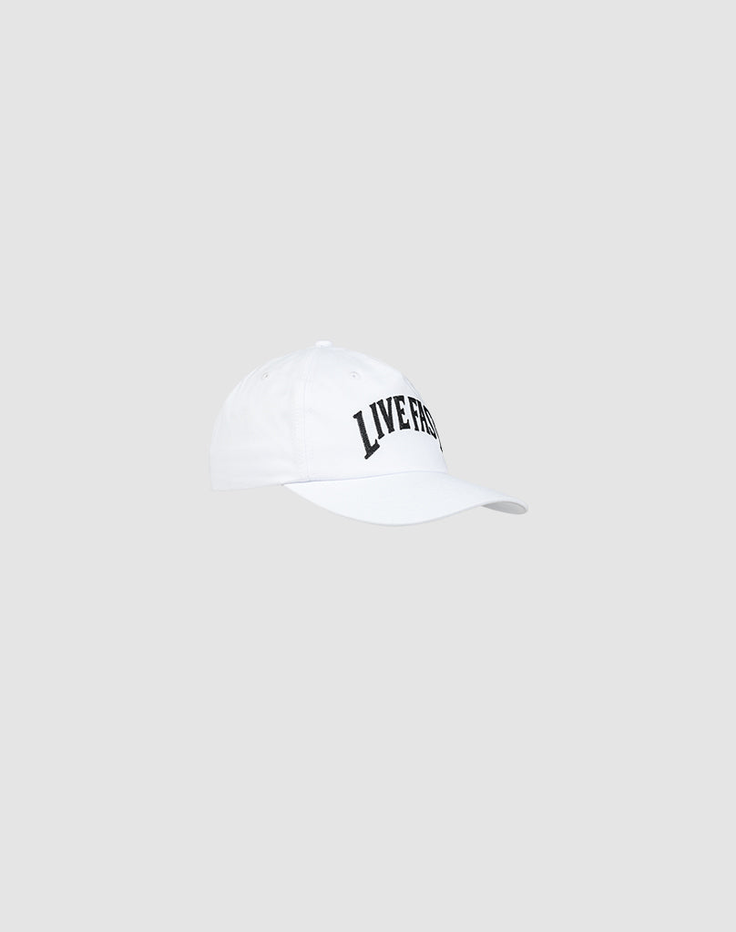 The Live Fast Unstructured Cap by LIVE FAST DIE YOUNG is a white cotton baseball cap with LIVE FREE in bold black letters on the front and a classic snap closure, shown on a plain light gray background.