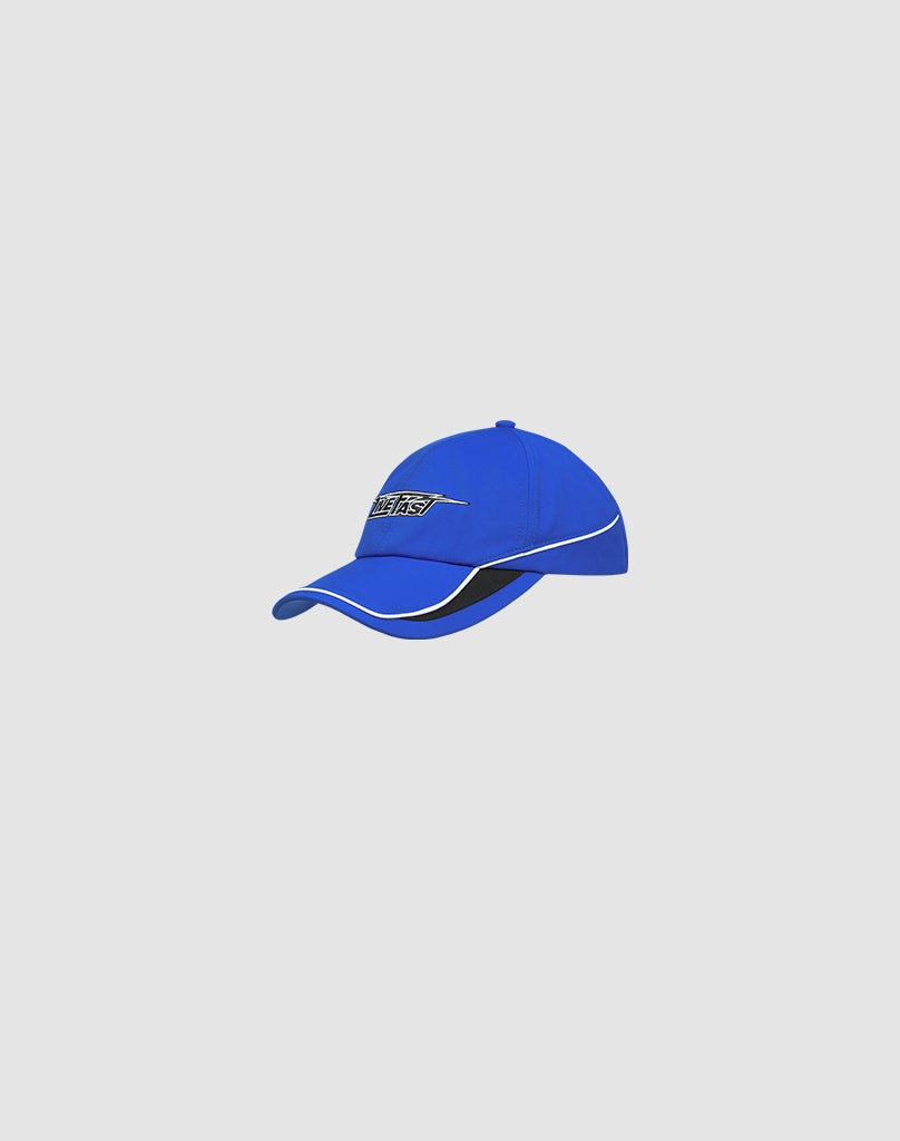 The Live Fast 3000 Cap by LIVE FAST DIE YOUNG is a bright blue polyester baseball cap with a curved brim, white piping along the edge, and a black and white text patch on the front, shown on a plain light grey background.
