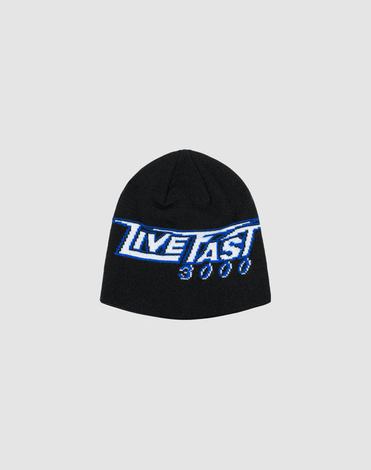 The LIVE FAST DIE YOUNG Live Fast 3000 Beanie is a black polyacryl hat featuring a blue and white LIVE FAST 3000 logo-strick graphic on the front, shown against a plain light gray background.| plain 