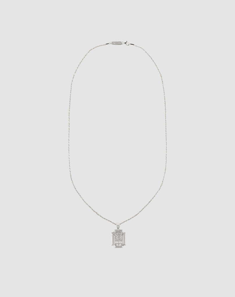 The LFDY Monaco Boys Plate Chain by LIVE FAST DIE YOUNG is a slim silver necklace with a rectangular pendant engraved with an ornate letter N, shown against a plain white backdrop.