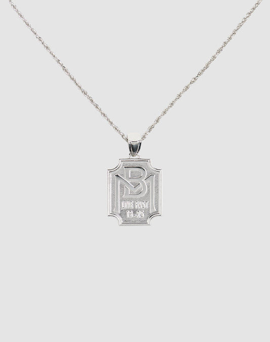 The LFDY Monaco Boys Plate Chain by LIVE FAST DIE YOUNG features an engraved rectangular pendant on a delicate, twisted sterling silver chain, displayed against a plain light background.