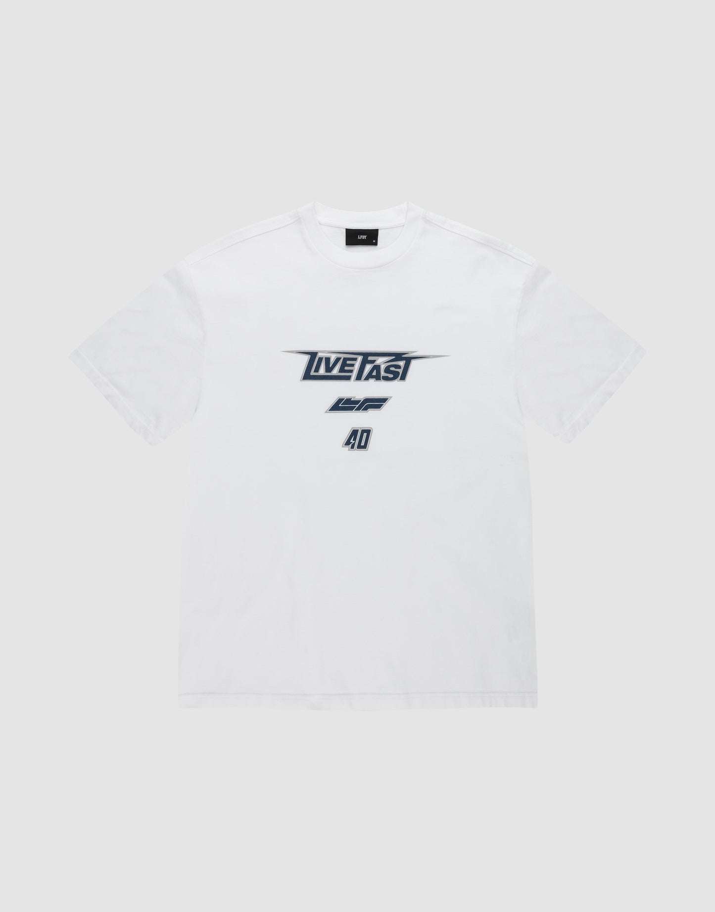 The LFDY Triple Racing Tee by LIVE FAST DIE YOUNG is a white shirt with black and gray multilogo front print—LIVE FAST in bold, AD below—crafted from 100% Baumwolle and shown against a light gray background.