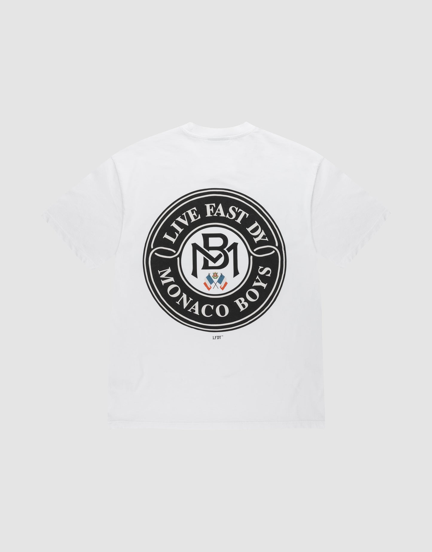 The LFDY Monaco Boys Tee by LIVE FAST DIE YOUNG is a white Oversize Fit T-shirt with a black circular back emblem reading "LIVE FAST DIE MONACO BOYS" around an MB logo and crest. Made from 100% cotton for comfort.