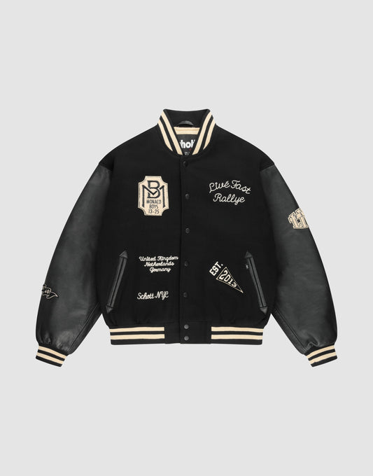 The LIVE FAST DIE YOUNG LFDY x Schott NYC Varsity Jacket is a limited edition black jacket with cream accents, leather sleeves, embroidered patches and text, plus striped cuffs, collar, and hem. | plain