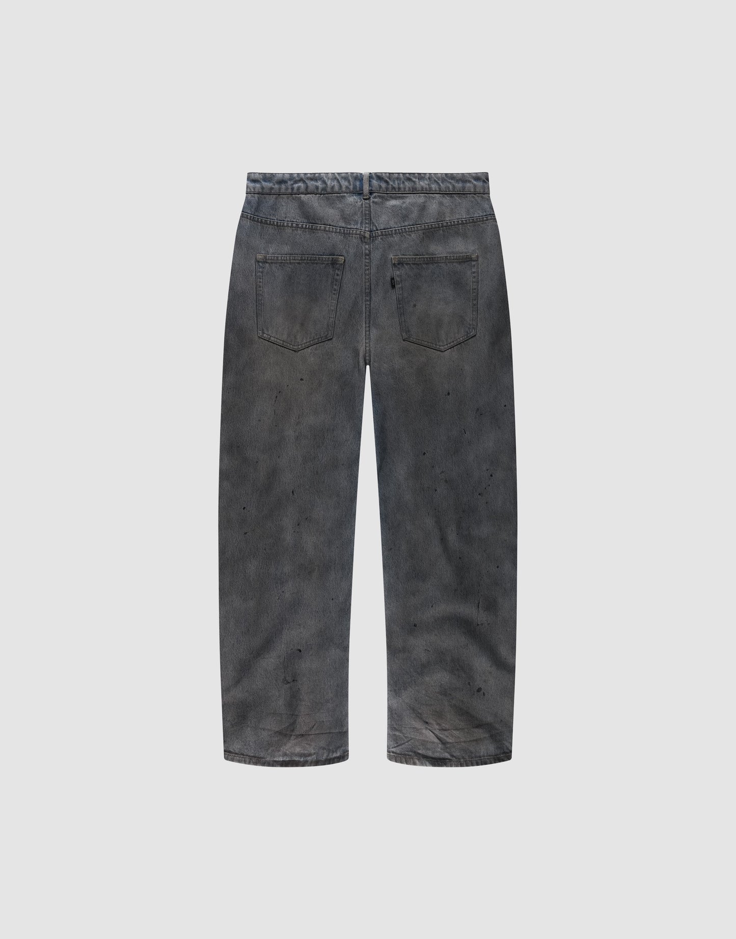 Back view of the LIVE FAST DIE YOUNG LFDY Coated Baggy Denim in faded black, made from 100% Baumwolle, featuring a baggy fit, two back pockets, and subtle paint splatters on a plain light gray background.