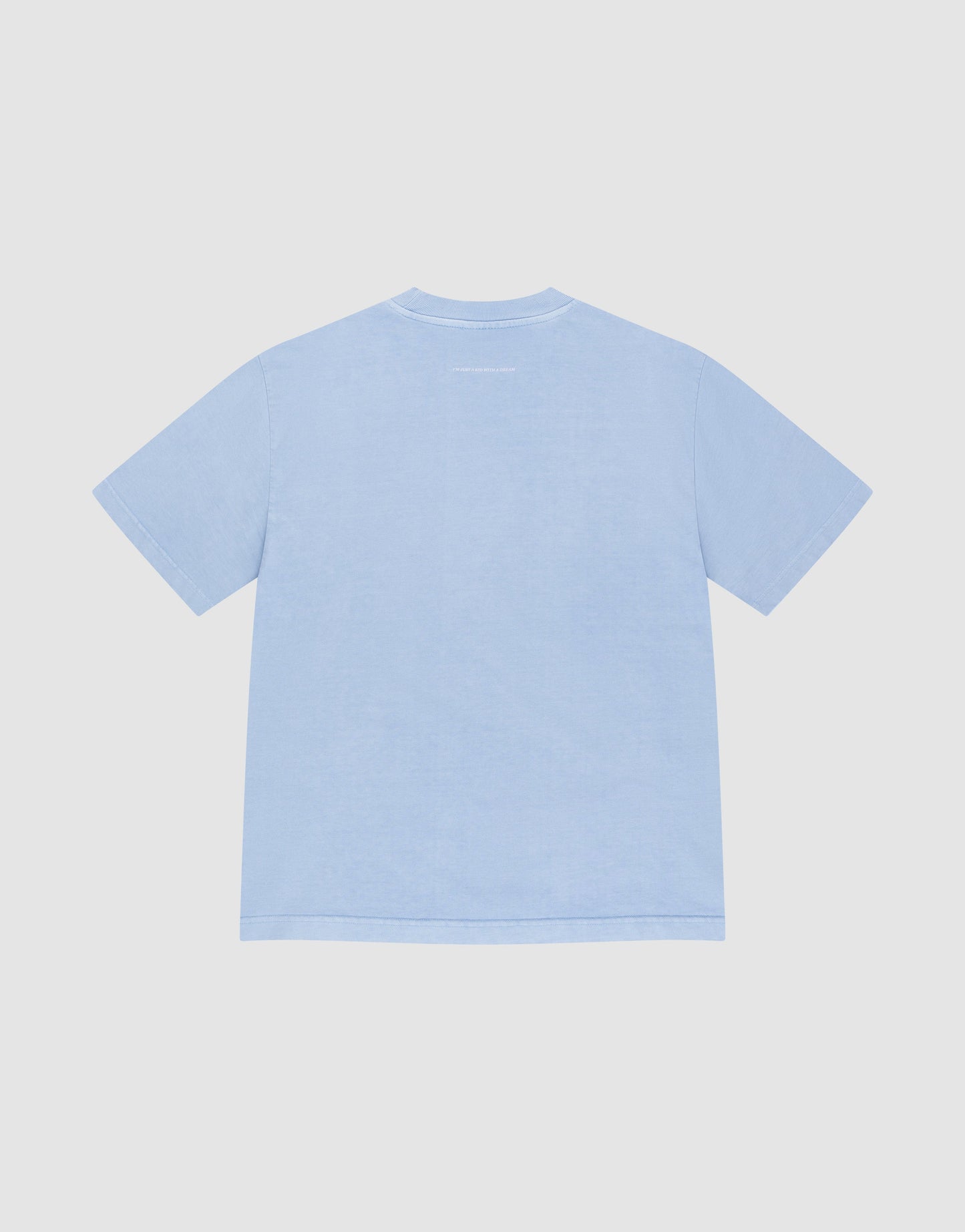 The LIVE FAST DIE YOUNG Live Fast College Tee, a plain light blue oversize fit short-sleeve t-shirt, is displayed flat with the back side up against a white background.