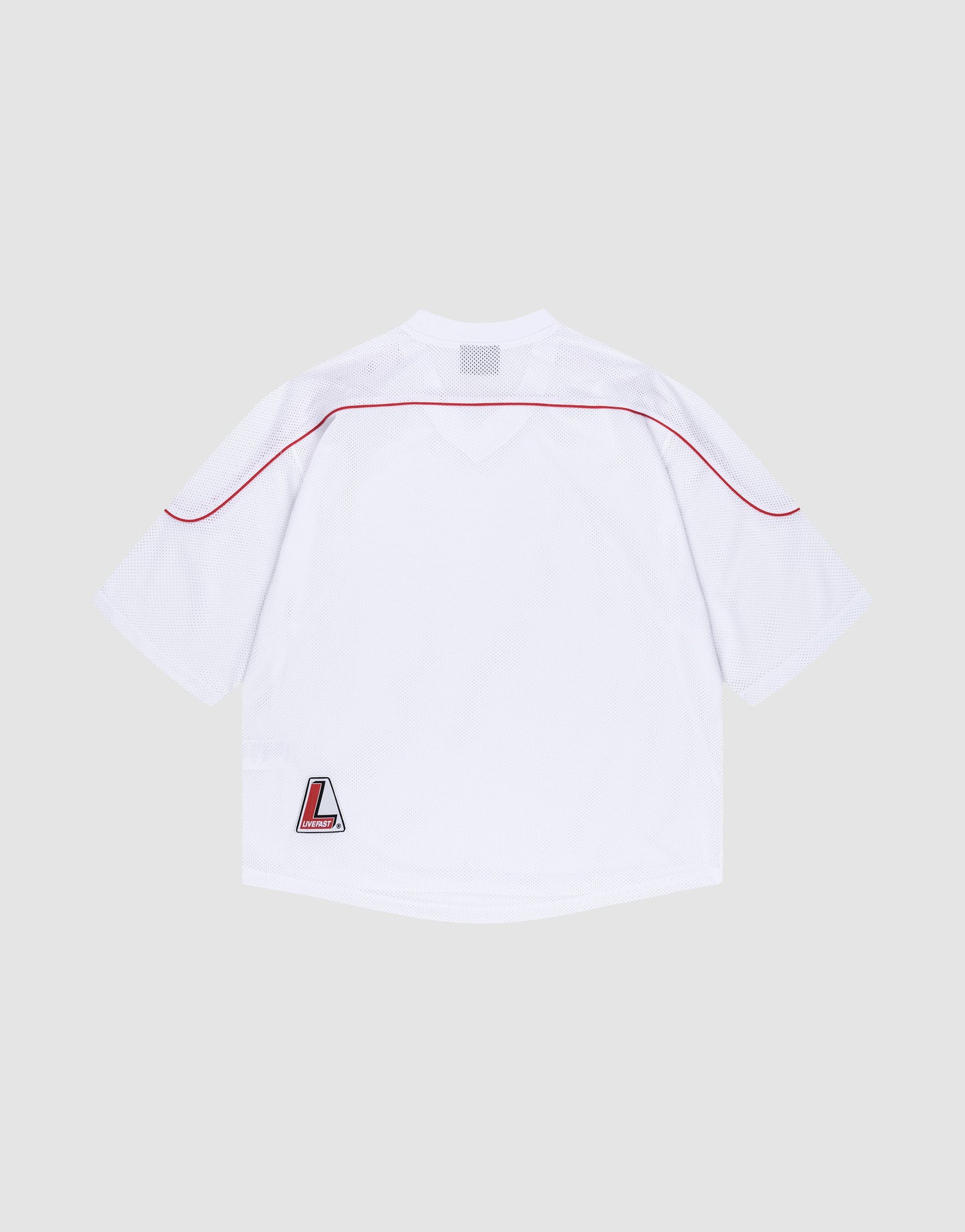The Basic Mesh Jersey by LIVE FAST DIE YOUNG is a plain white polyester sports top with short sleeves, a red shoulder stripe, V-Ausschnitt neckline, and L logo patch at the lower left hem. It’s shown laid flat, back view, on a light gray background.