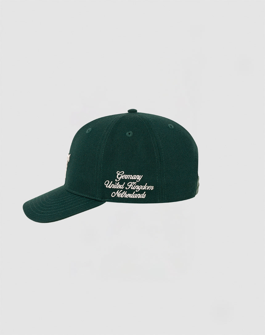 The LF Snapback by LIVE FAST DIE YOUNG is a dark green cap with Multi-Logo Stick, white Germany, United Kingdom, Netherlands text on the side, Mit Snapverschluss closure (style LF2308-14417), shown on a plain light gray background.