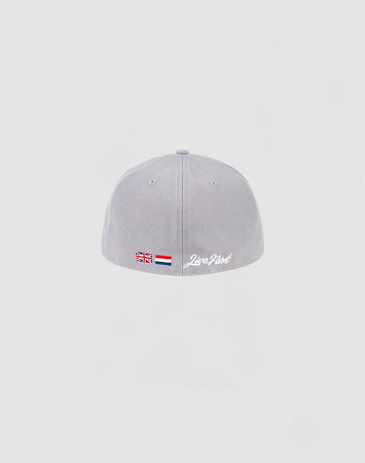 A light grey LFDY x NEW ERA 59FIFTY Low Profile fitted cap by LIVE FAST DIE YOUNG is shown from the back, with small UK and Dutch flags, the Netherlands flag, and Zero Part embroidered in white on a plain light grey background.