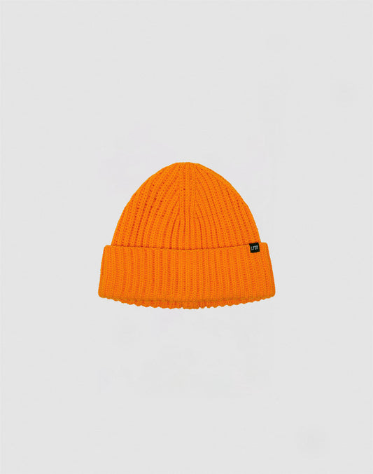 The LIVE FAST DIE YOUNG Rib Knit Beanie in bright orange features a folded brim and a small black side tag, shown against a plain light gray background.