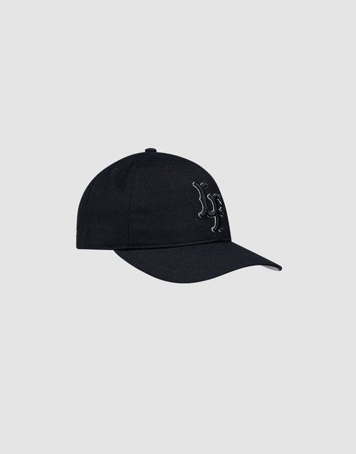 The LFDY Snapback by LIVE FAST DIE YOUNG is a black cap with a curved brim and gray underside, featuring an embroidered white and black "R" on the front and an adjustable snap closure. Shown on a plain light gray background.