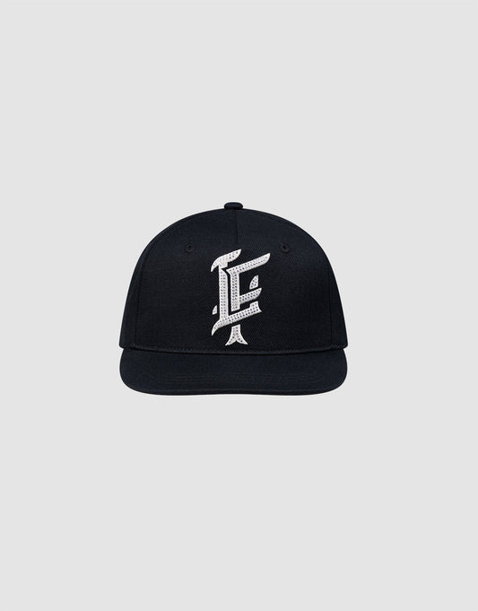 The LF Rhinestone Cap by LIVE FAST DIE YOUNG features a black cotton design with a bold white embroidered letter F on the front, showcased against a plain light gray background.| plain 