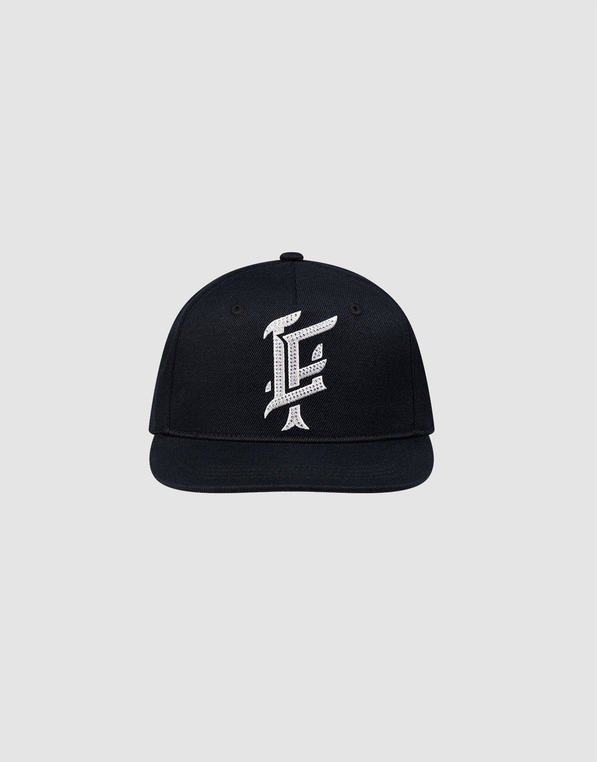 The LF Rhinestone Cap by LIVE FAST DIE YOUNG features a black cotton design with a bold white embroidered letter F on the front, showcased against a plain light gray background. 
