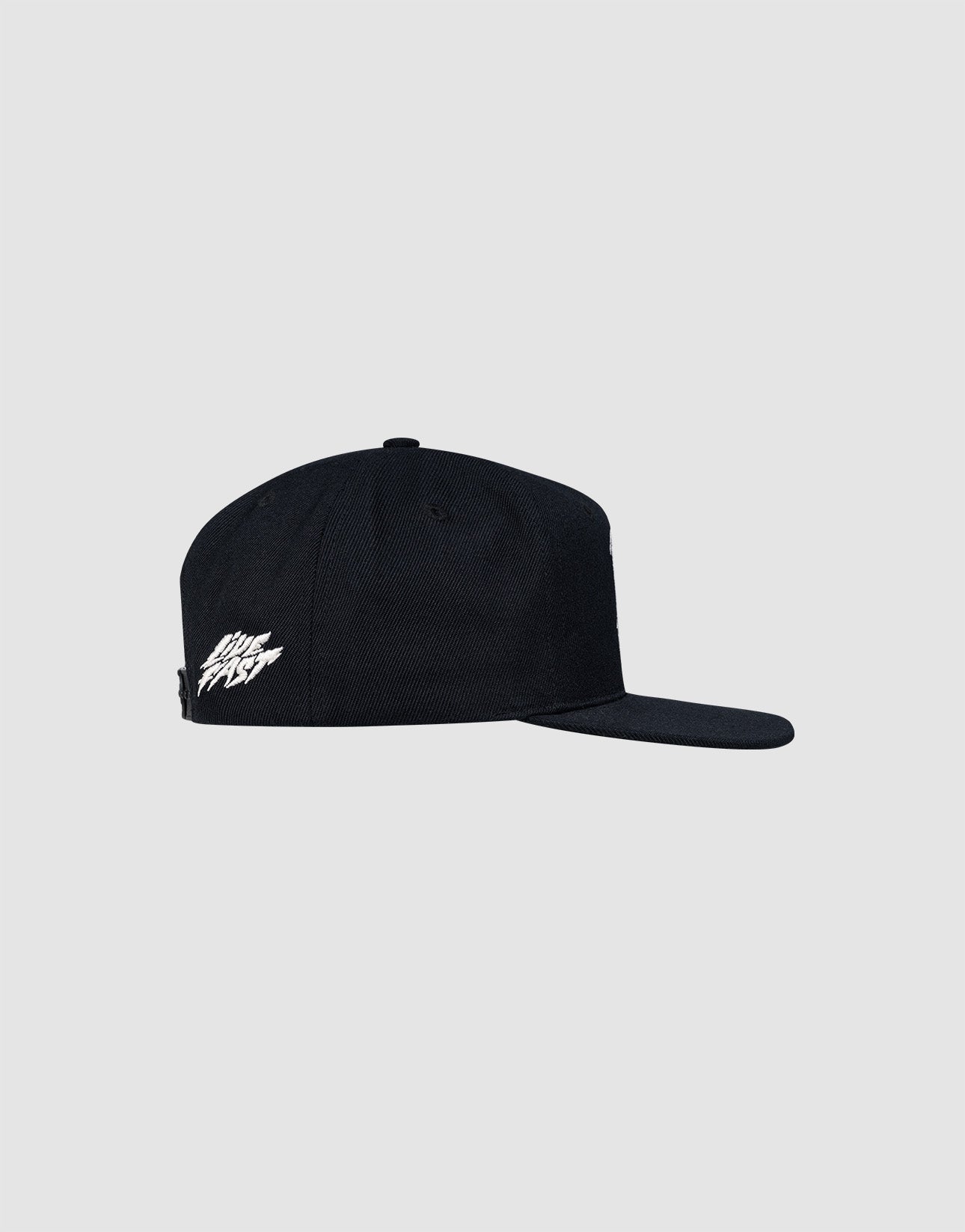 A black LF Rhinestone Cap by LIVE FAST DIE YOUNG, featuring a white embroidered logo on the side and a flat brim, shown in profile against a light gray background.