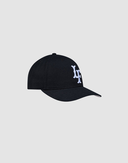 The LFDY Snapback by LIVE FAST DIE YOUNG is a black baseball cap with a curved brim, white Multi-Logo-Stick embroidery, Snapverschluss, and ONE SIZE fit. Shown against a light gray background.