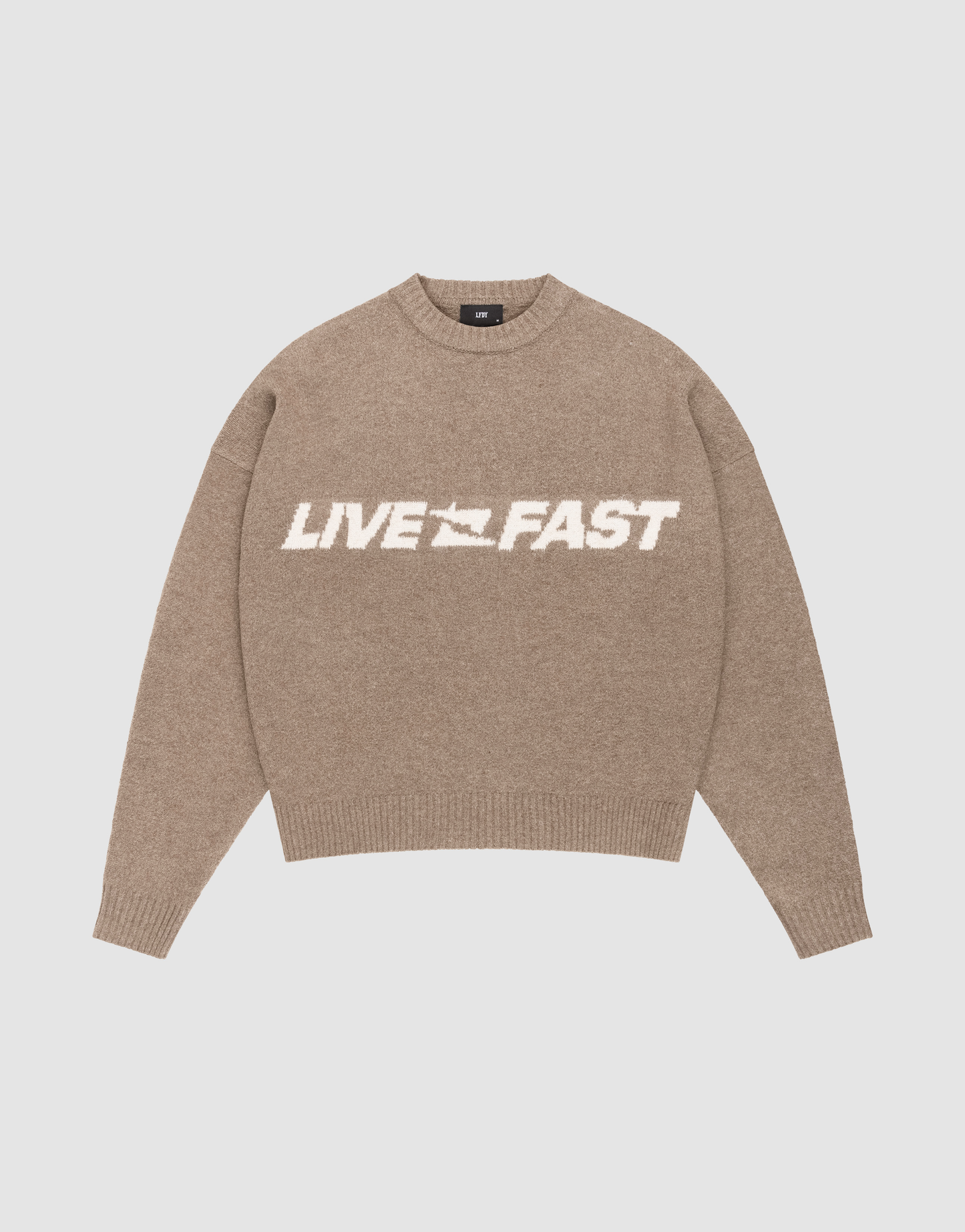 The Live Fast Boucle Sweater by LIVE FAST DIE YOUNG is an oversize beige knit with "LIVE FAST" in bold white on the chest, classic crew neck, and long sleeves for cozy comfort. | plain