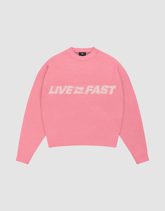 The Live Fast Boucle Sweater by LIVE FAST DIE YOUNG is a pink oversized crewneck with "LIVE FAST" in bold white letters, made from soft polyester knit with long sleeves and ribbed cuffs, waistband, and neckline. | plain