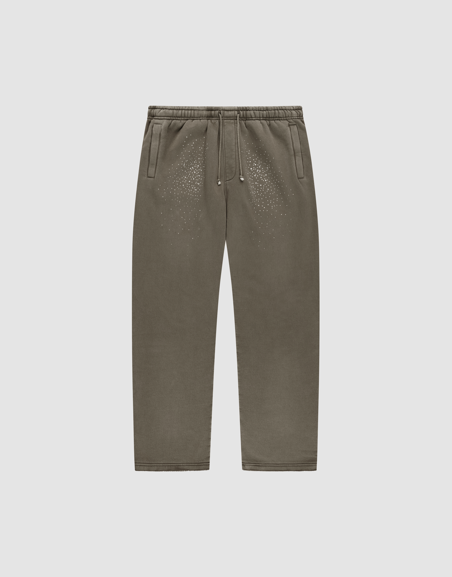 The LIVE FAST DIE YOUNG Live Fast Rhinestone Jogger, in olive green with an elastic waistband, drawstring, side pockets, and rhinestone detail, is shown laid flat on a plain light gray background. | plain