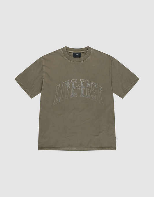 The Live Fast Rhinestone Tee by LIVE FAST DIE YOUNG is an olive green, oversized short-sleeve t-shirt featuring a vintage wash and "LIVE FAST" in large faded white letters across the chest, with a crew neck and relaxed fit. | plain