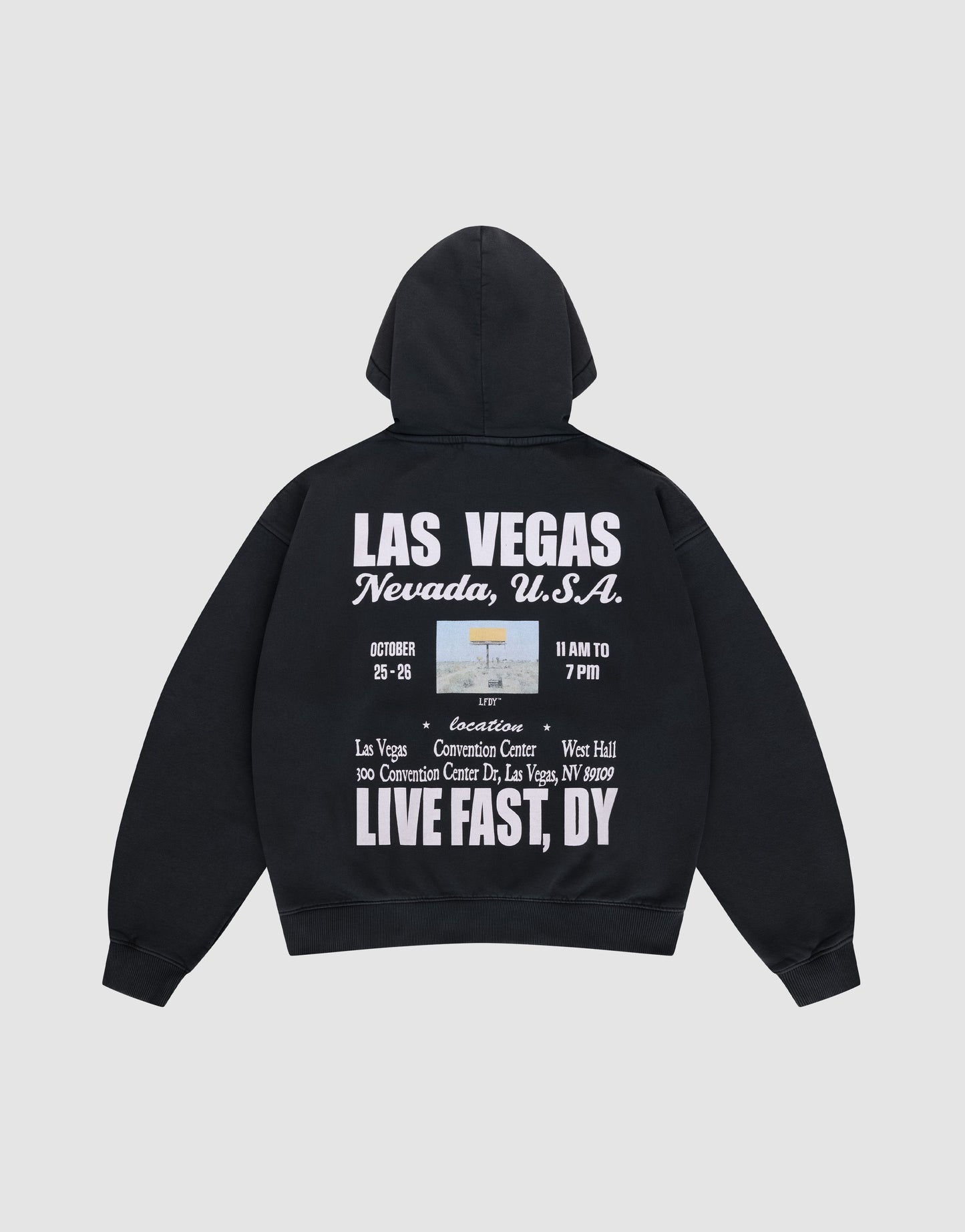 The Live Fast Vegas Hooded by LIVE FAST DIE YOUNG is a black oversize-fit hoodie with a cozy hood, front and back prints, bold white "LAS VEGAS Nevada, U.S.A." text, event details, and phrases like LIVE FAST, DY, and Convention Center.