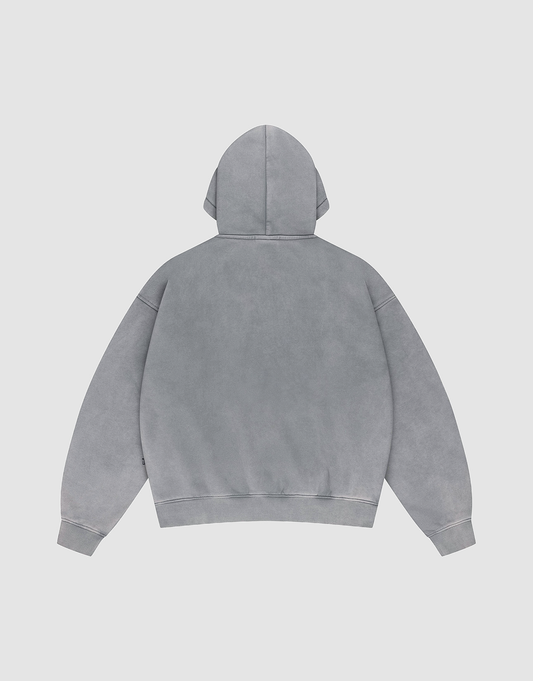 The LIVE FAST DIE YOUNG Basic +49 Hooded is a plain, oversized gray hoodie shown from the back with a large hood, dropped shoulders, and ribbed cuffs and hem, set against a neutral background and featuring no visible logos or designs.