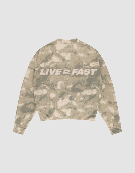 The Live Fast Boucle Sweater by LIVE FAST DIE YOUNG features a beige and light brown camo pattern, an oversized fit, and bold white "LIVE FAST" lettering on the back. | plain