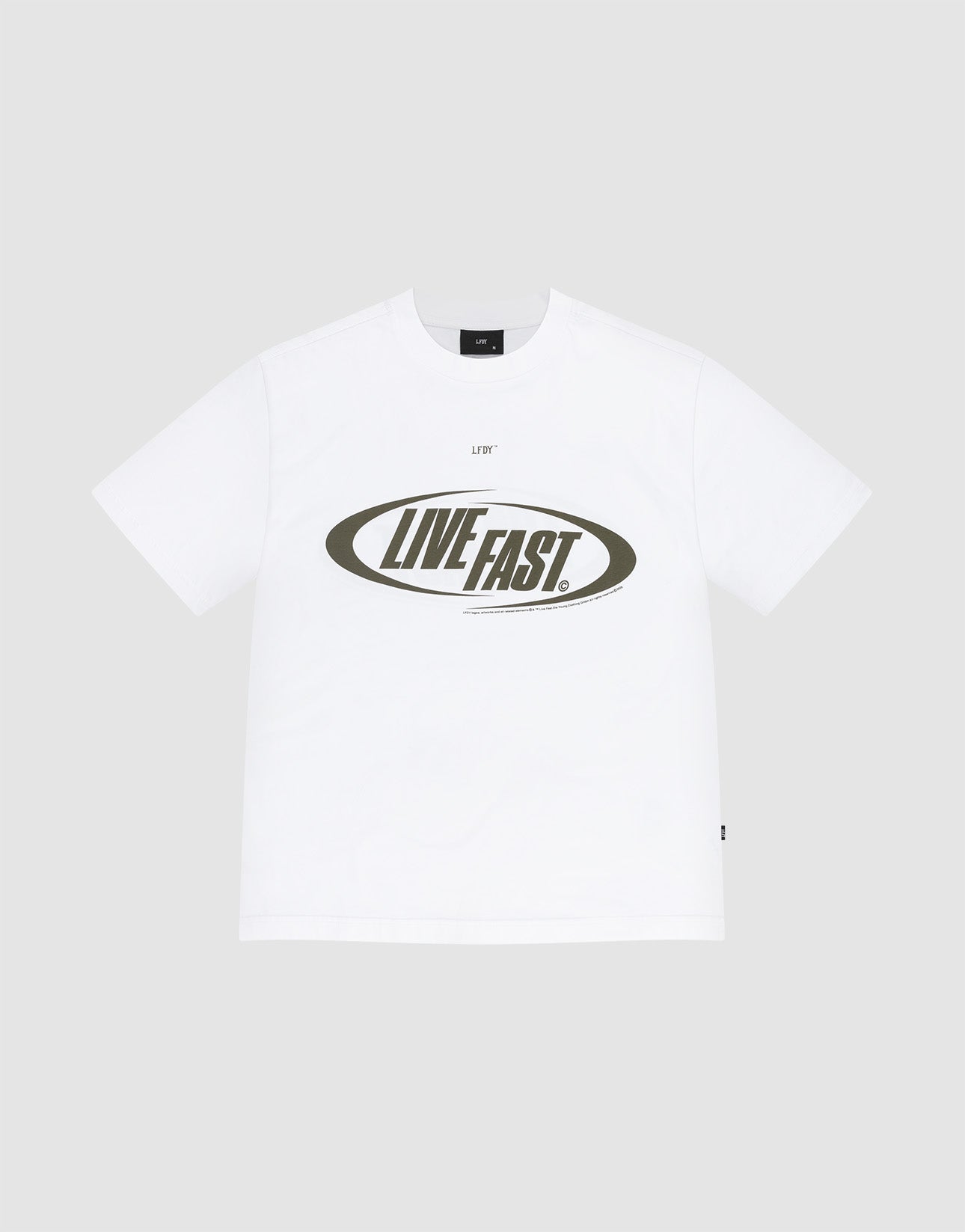 The LFDY Sphere Tee by LIVE FAST DIE YOUNG is an oversized white cotton short-sleeve t-shirt with a bold, uppercase LIVE FAST. oval front print on a plain light gray background. | plain
