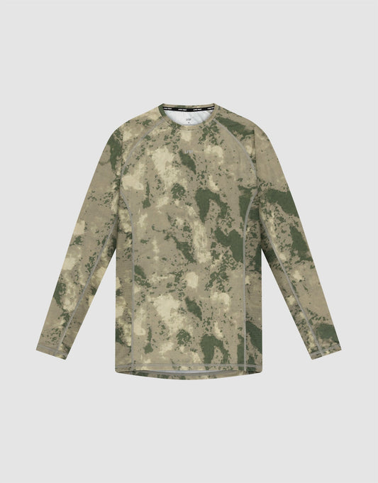 The LIVE FAST DIE YOUNG LFDY Performance Slim Longsleeve is a green and tan camo athletic shirt with a slim fit and reflective logo print, shown flat on a light gray background. | plain