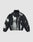 The LFDY Performance Jacket by LIVE FAST DIE YOUNG features a black and white zip-up nylon design with a high collar and abstract tie-dye-style allover print on a gray background.