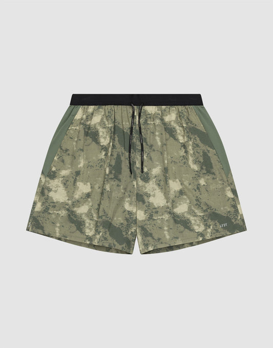 The LFDY Performance Running Shorts by LIVE FAST DIE YOUNG feature a green and beige camo pattern, integrated tights, black drawstring waistband, side panels, and a practical phone pocket, shown against a plain white background. | plain