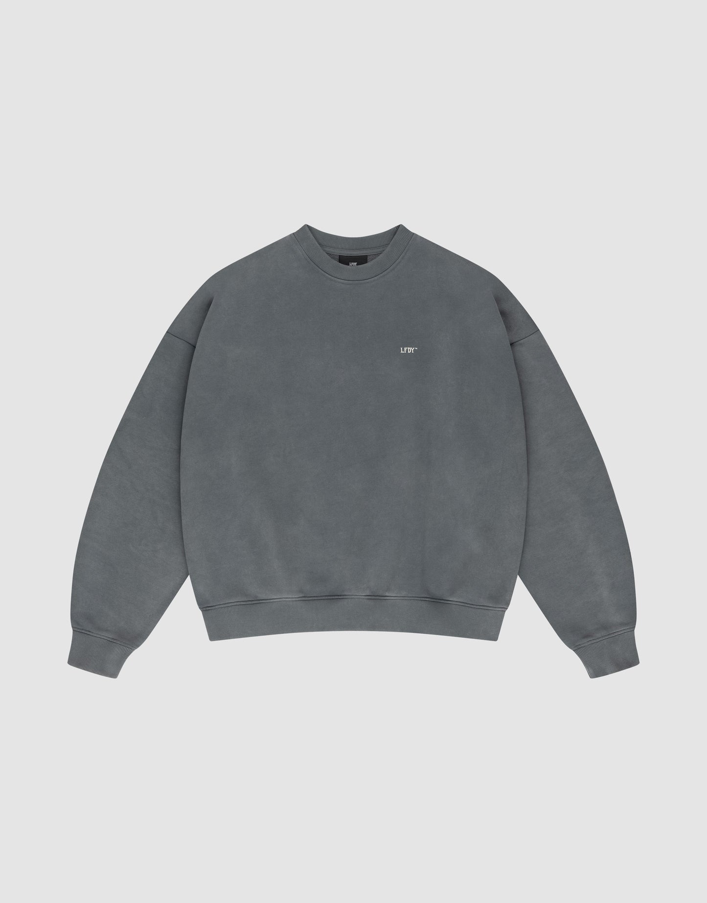 The Basic Chest Sweater by LIVE FAST DIE YOUNG is a plain, oversized faded grey crewneck with soft cotton, long sleeves, ribbed trims, and a subtle white OFF front print on the left chest.