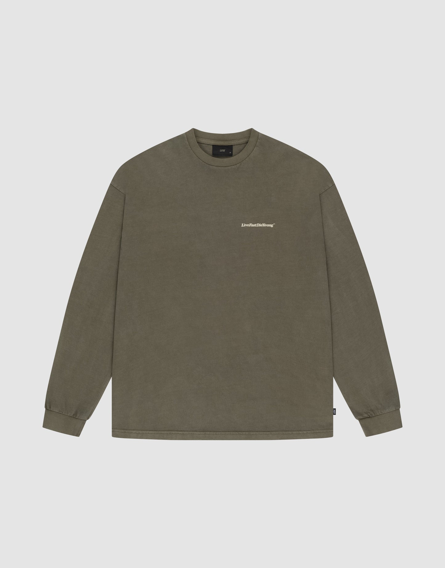 The LIVE FAST DIE YOUNG Basic Longsleeve is an olive green, long-sleeved crew neck T-shirt made from 100% Baumwolle, featuring a small white logo on the left chest and shown on a plain light background.
