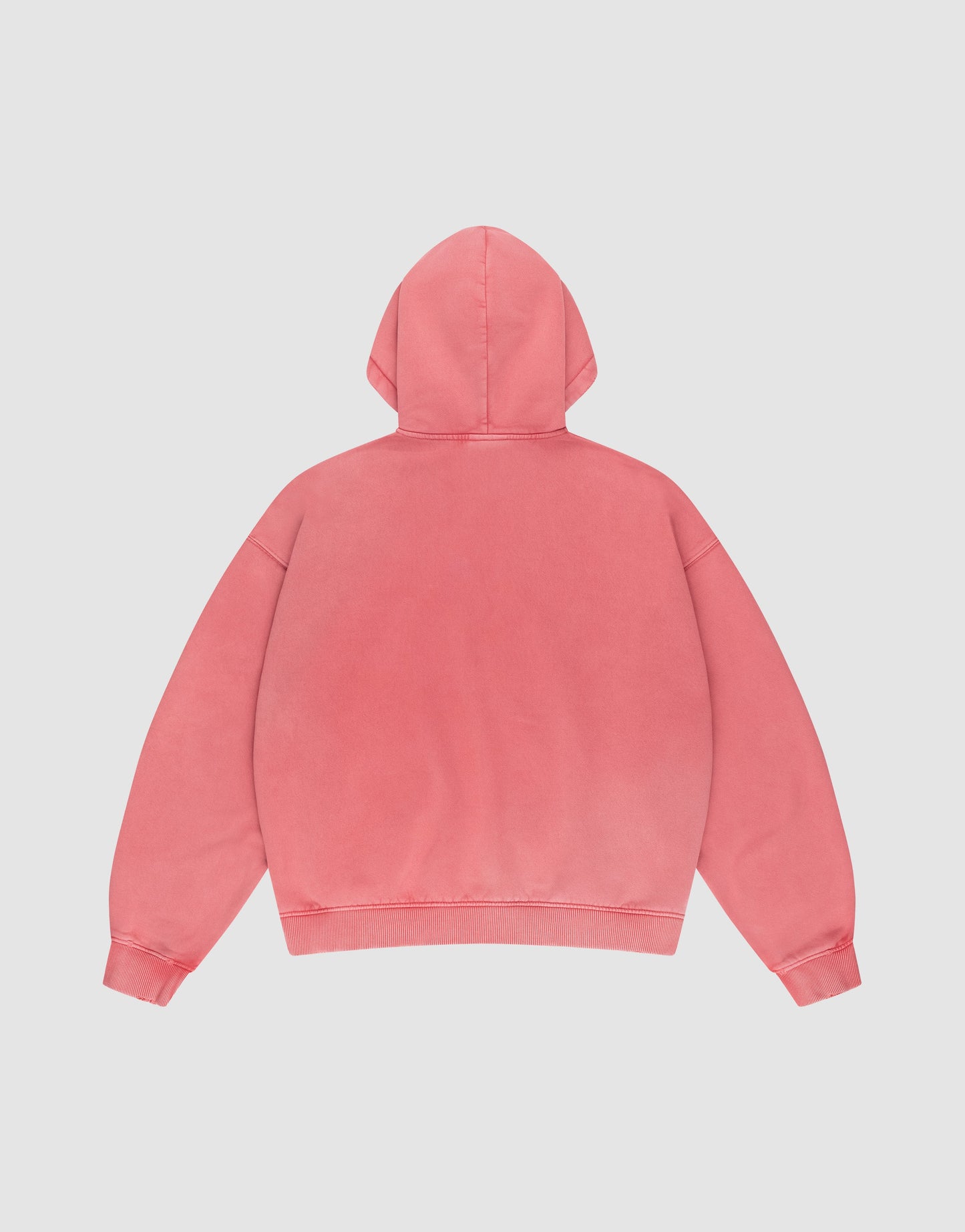 A pink Basic Hooded Zip from LIVE FAST DIE YOUNG is laid flat, back facing up, on a white background. It has an oversize fit, long sleeves, and features no visible designs or logos.
