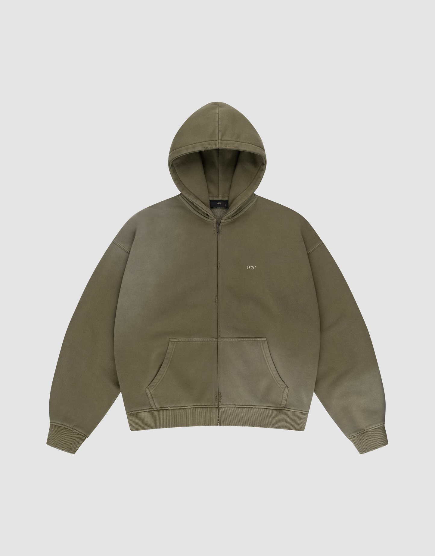 The LIVE FAST DIE YOUNG Basic Hooded Zip is an olive green oversized zip-up hoodie with a hood, front pouch pockets, and a subtle “LIFE” logo on the left chest, shown laid flat on a plain light gray background. | plain