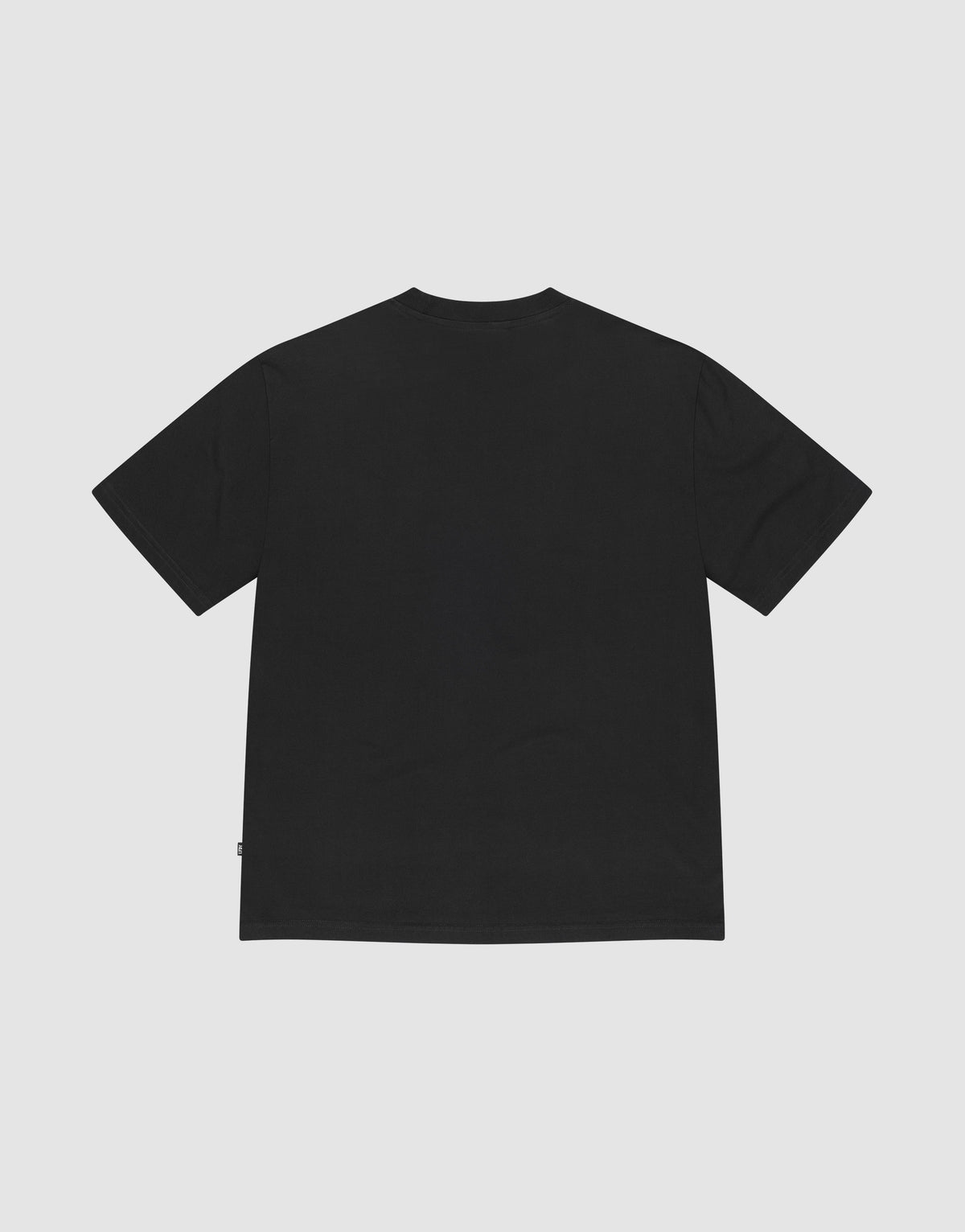 The Basic Chest Tee by LIVE FAST DIE YOUNG is a plain black short-sleeve T-shirt made from 100% Baumwolle, laid flat on a white background to show the back with a simple crew neck and no visible designs or logos.