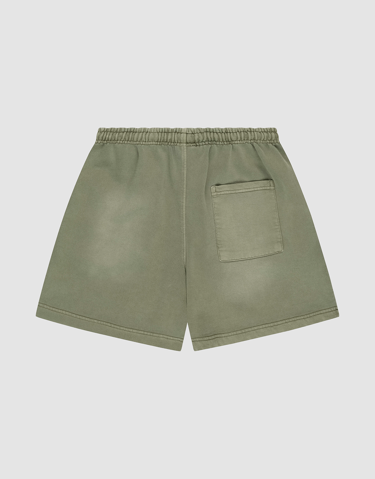 The LIVE FAST DIE YOUNG Basic Sweat Shorts in olive green feature an elastic waistband, a back right patch pocket, and an oversized fit, shown against a plain light gray background.