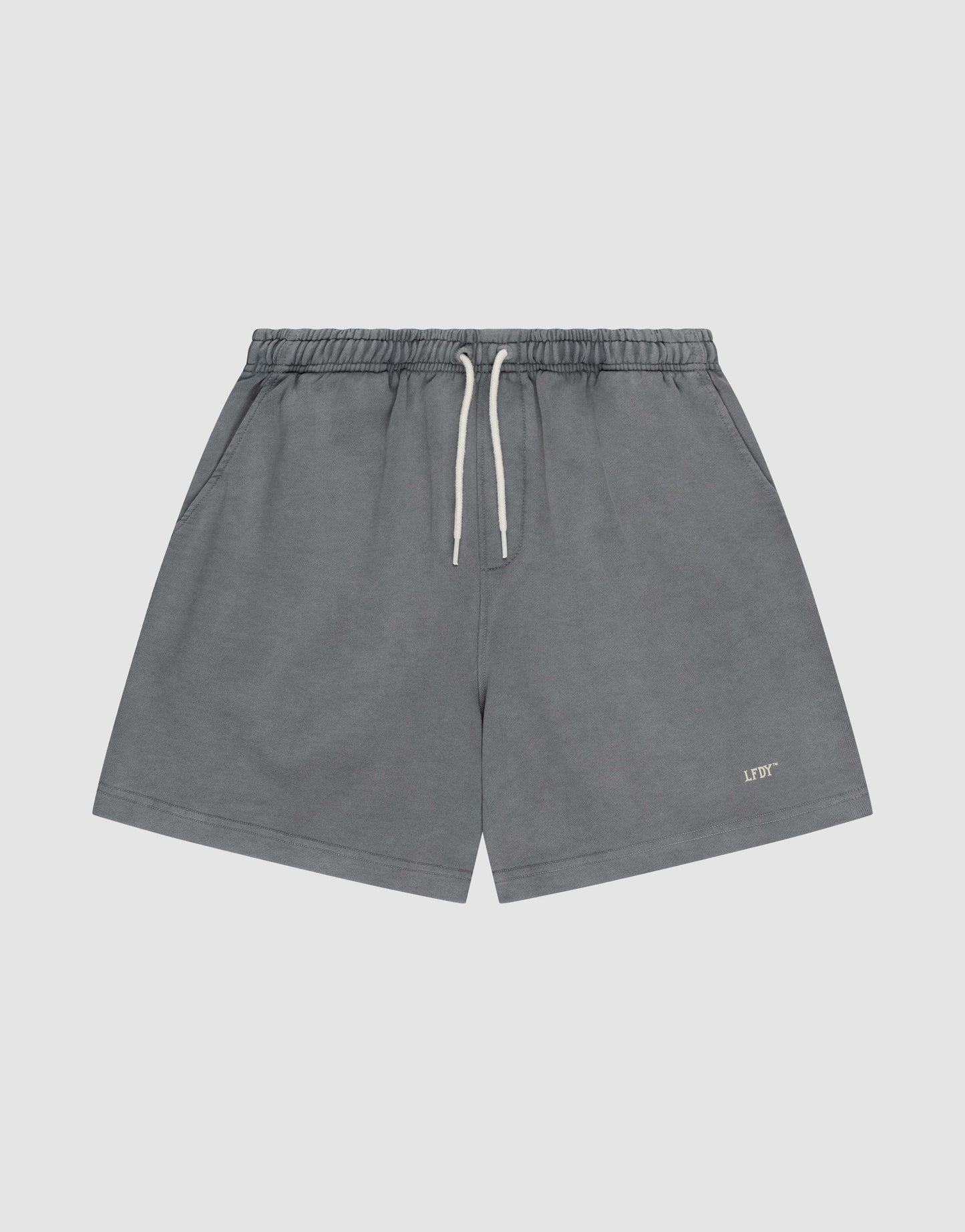 LIVE FAST DIE YOUNG Basic Sweat Shorts in gray with an elastic waistband, side pockets, and a small “LIFT” logo print on the lower left leg, shown against a plain light background.