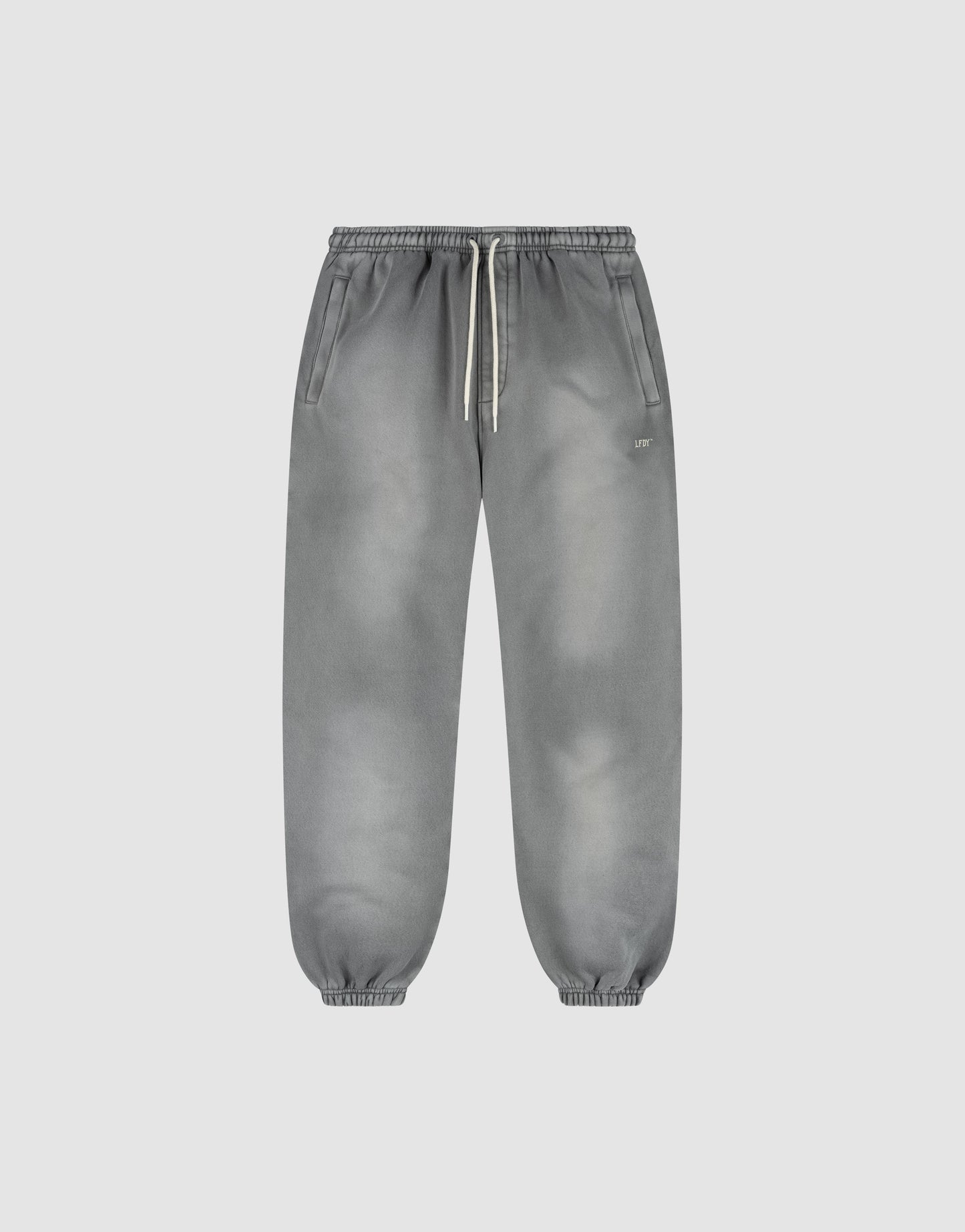 The LIVE FAST DIE YOUNG Basic Loose Jogger is a pair of gray washed sweatpants with a subtle fade effect, elastic waistband and white drawstring, side pockets, and elastic ankle cuffs, shown on a plain light background.