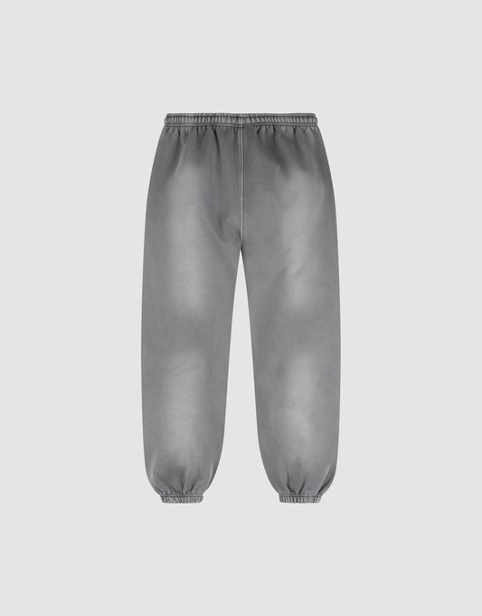 The LIVE FAST DIE YOUNG Basic Loose Jogger features a gray wash, relaxed fit, elastic waistband and cuffs, and an effortless Fade-Effekt. Displayed on a plain white background.