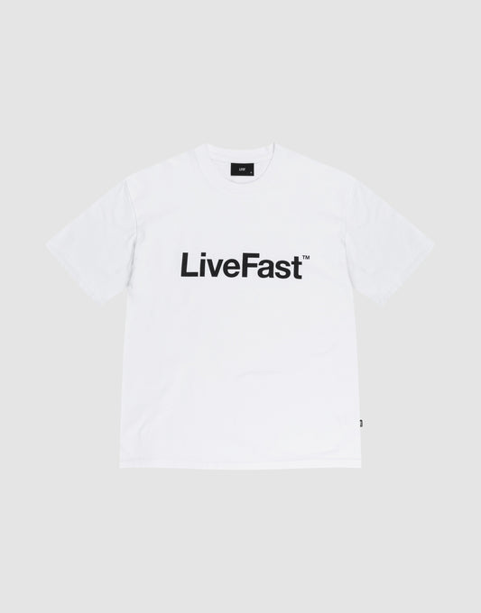 The Basic LiveFast Tee by LIVE FAST DIE YOUNG is a Regular Fit plain white T-shirt featuring a bold black "LiveFast™" front print, laid flat on a light gray background. Crafted from 100% Baumwolle for comfort and style.
