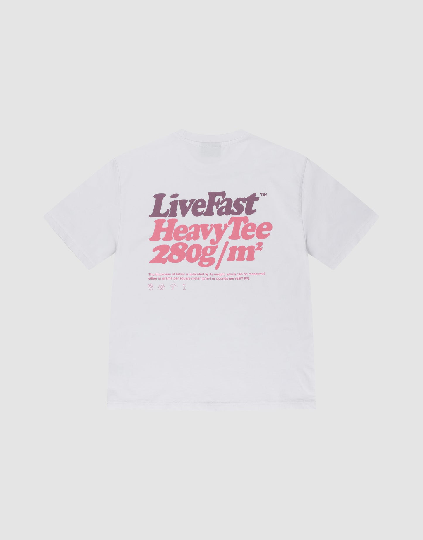 The LIVE FAST DIE YOUNG Basic 280 Tee is a white oversize fit t-shirt with a bold purple and pink “LiveFast HeavyTee 280g/m²” backprint, plus icons and text below. Made from 100% Baumwolle, shown on a plain light background.