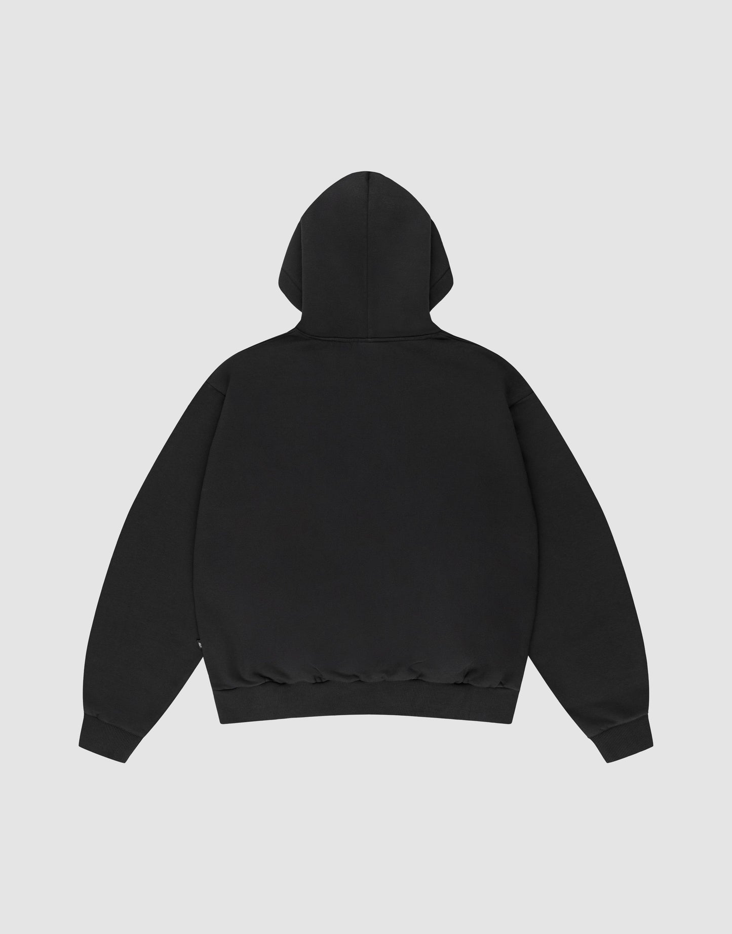 The LIVE FAST DIE YOUNG Basic Blank Hooded is a plain black hoodie shown from the back, made from soft Baumwolle with an oversize fit, long sleeves, and ribbed cuffs and waistband, displayed on a light gray background.
