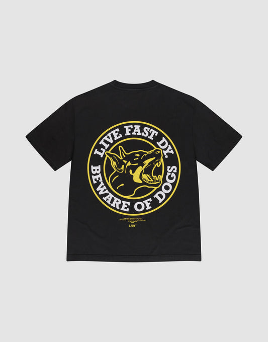 The LFDY Circle Dog Tee by LIVE FAST DIE YOUNG is a black oversized 100% cotton tee with a bold yellow and white snarling dog graphic on the back, encircled by "LIVE FAST DY BEWARE OF DOGS" in capital letters. | plain