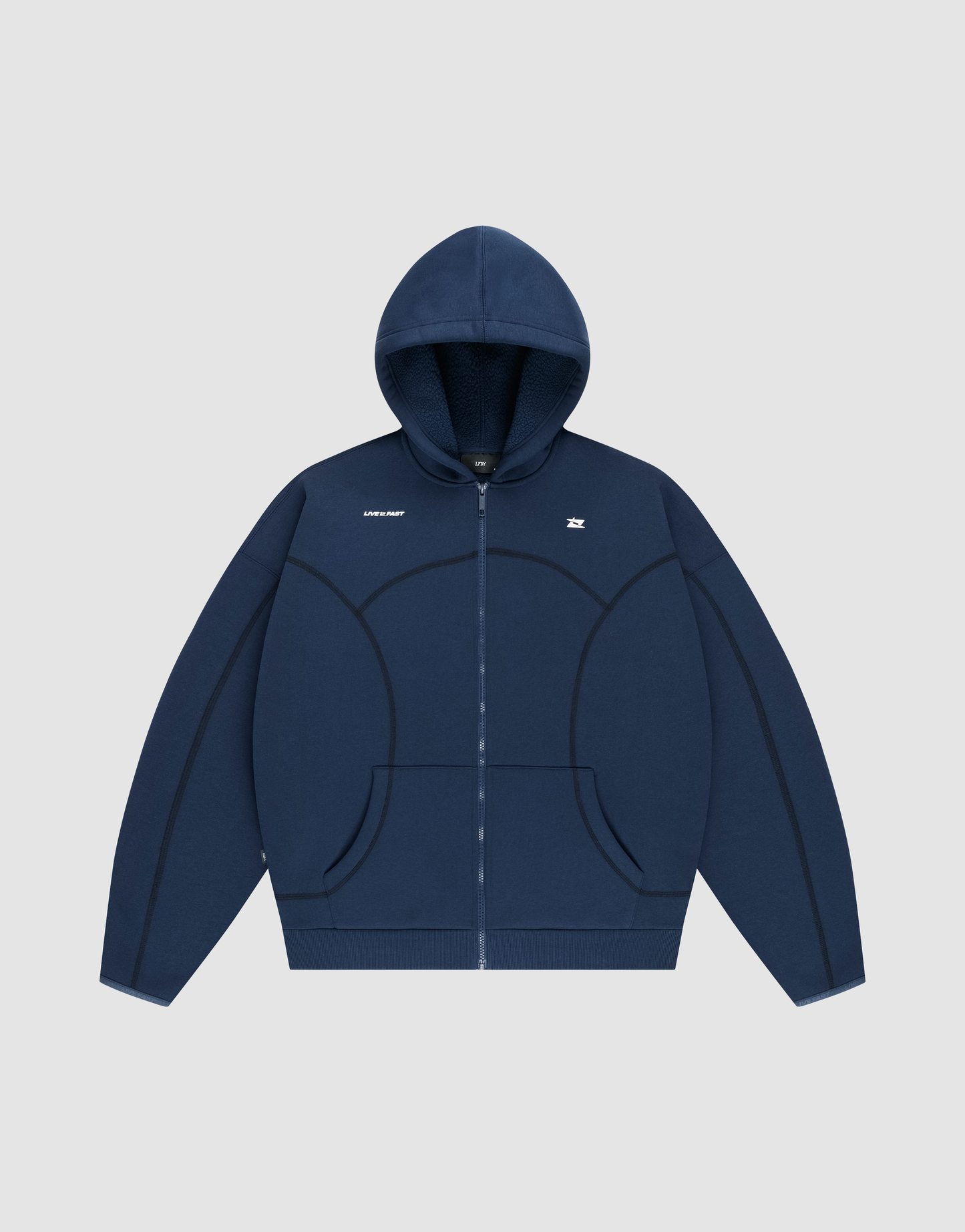 The LFDY Active Fleece Hooded Zip by LIVE FAST DIE YOUNG is a navy oversized zip-up hoodie with a hood, front pockets, black curved seams, and a small white chest logo, made from premium Baumwolle and shown on a light gray background. | plain