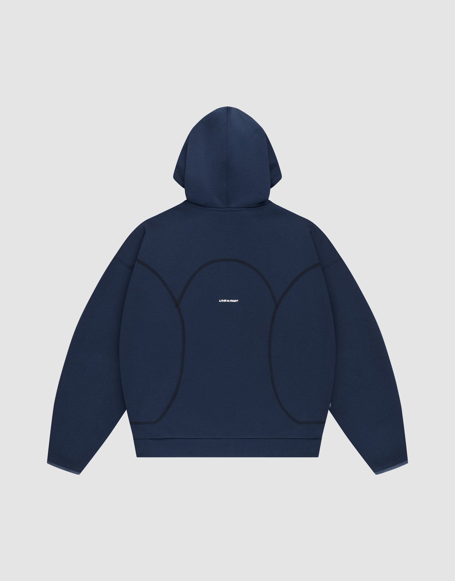 A navy blue oversized LFDY Active Fleece Hooded Zip by LIVE FAST DIE YOUNG is shown flat with the hood up, featuring black curved seam details and small white logo print centered on the back.