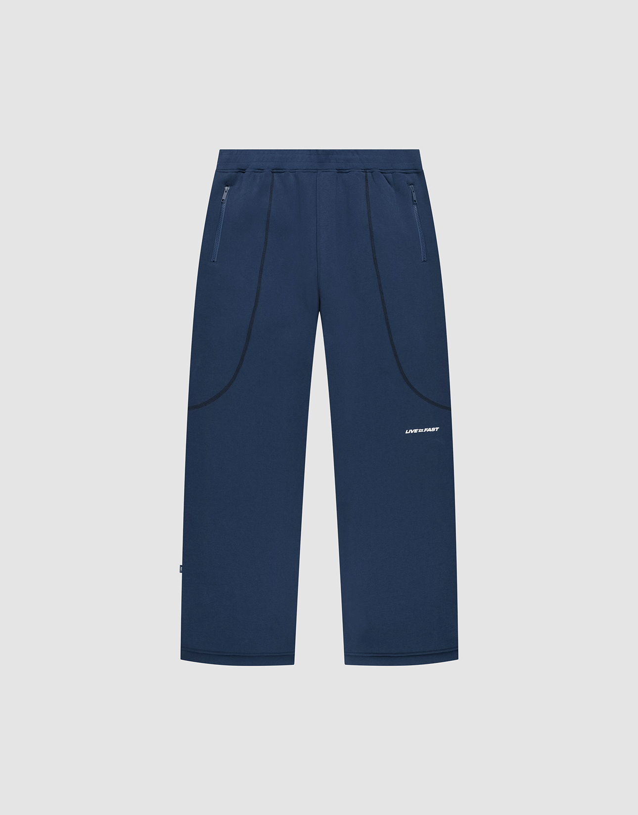 The LFDY Active Fleece Jogger by LIVE FAST DIE YOUNG features a navy blue wide fit, straight legs, zippered side pockets, black curved seam details, and a small white logo on the right thigh, shown on a light gray background. | plain